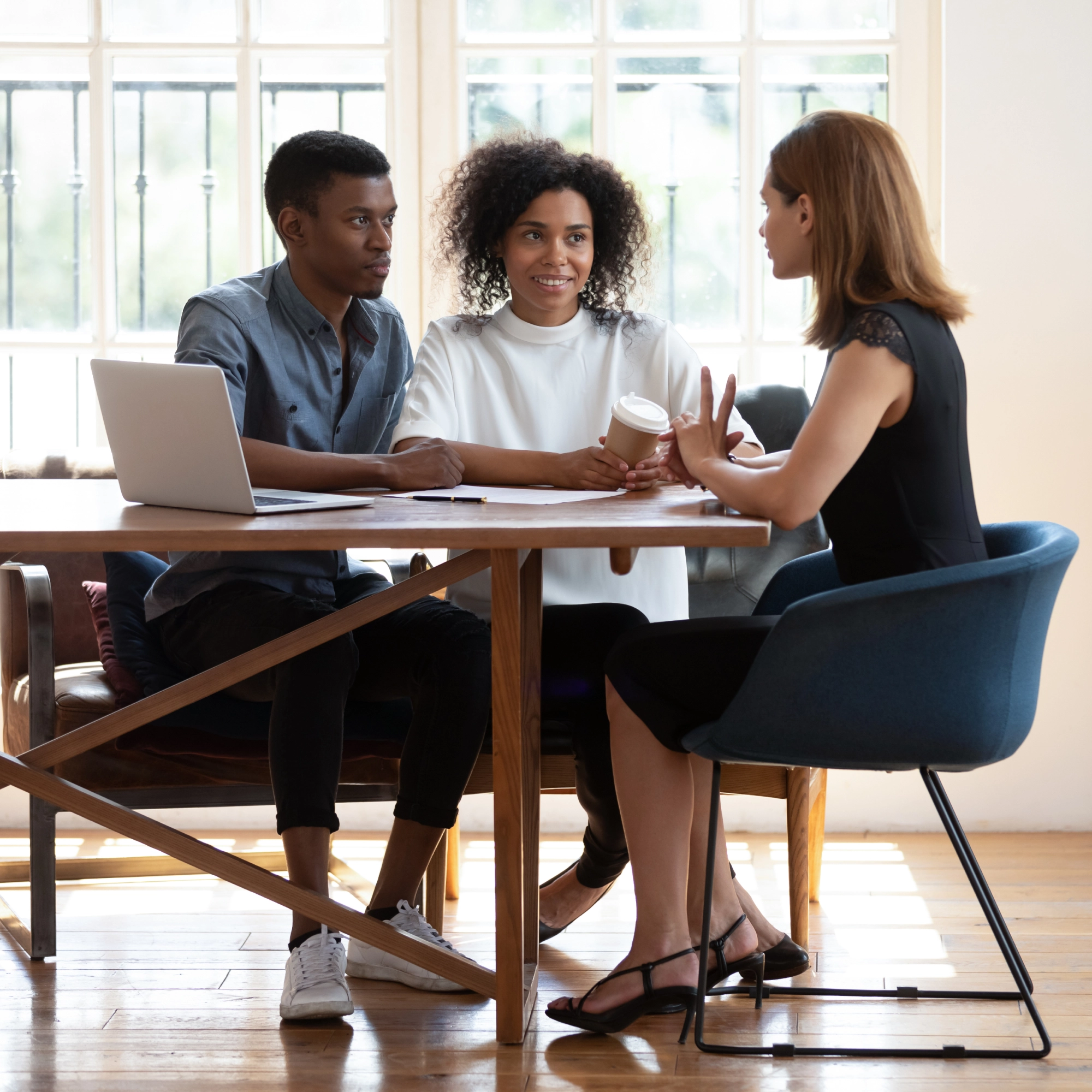 Business meeting, diverse team discussion.